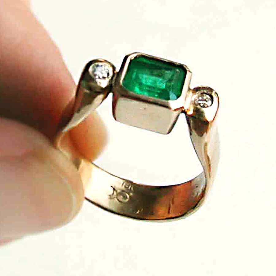 hand forged yellow gold and emerald ring