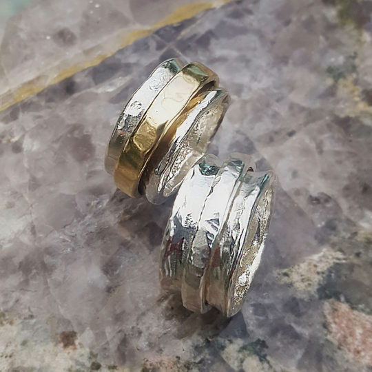 sterling silver and 14k yellow gold rolling rings